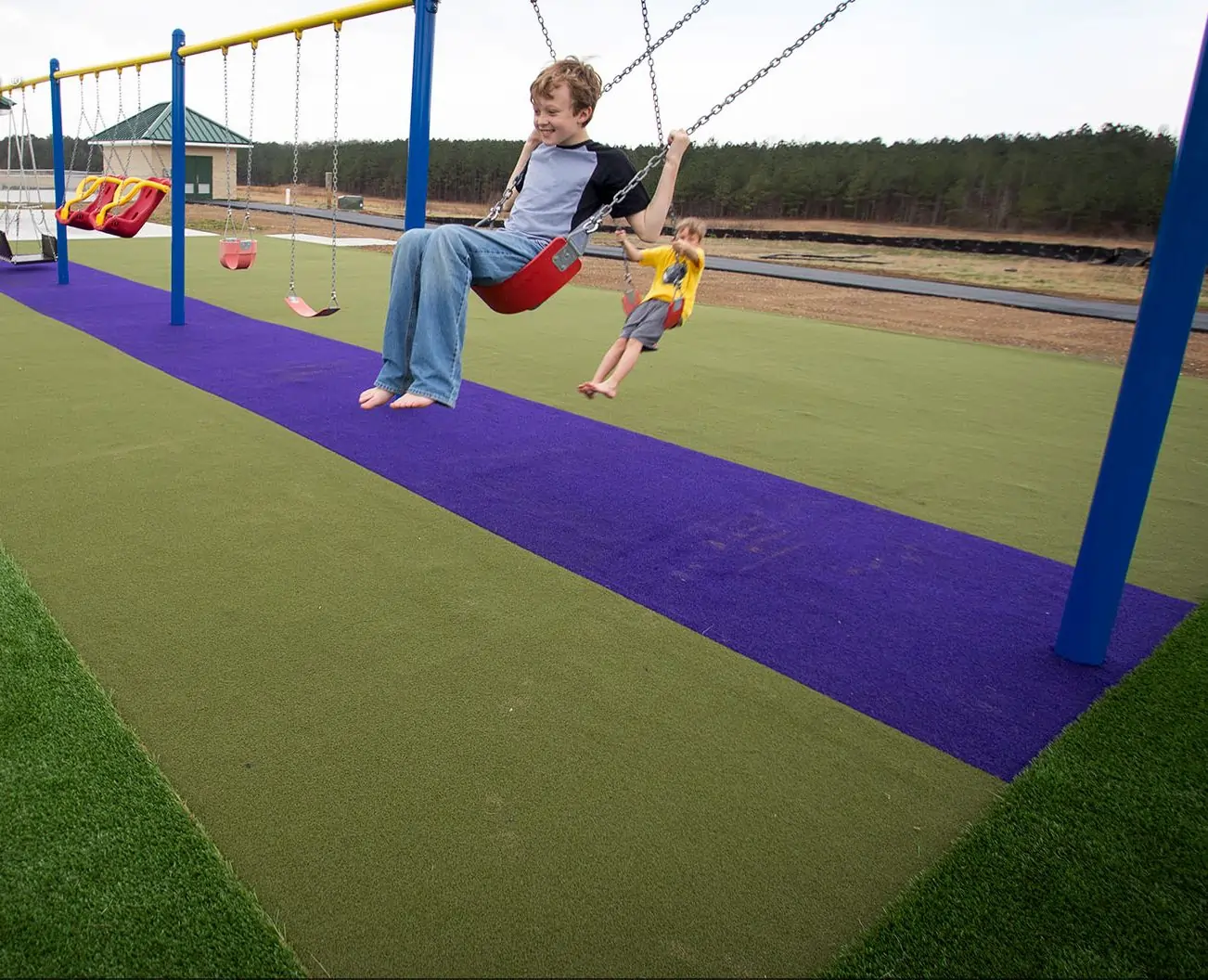 children playing public park artificial grass lawn