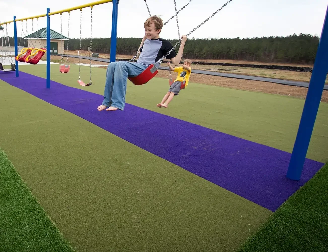 children playing public park artificial grass lawn